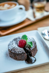 chocolate lave and raspberry fruit and pepper mint dessert in coffee cafe