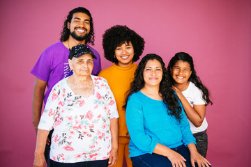 Family portrait of Latinx/Afrolatinx family in studio environment