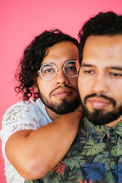 Portrait of Latino twin brothers in studio environment