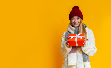 Portrait of smiling girl with festive gift