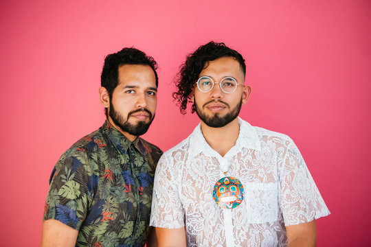 Portrait of Latino twin brothers in studio environment