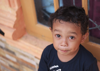 Little Asian boy at home