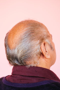 Portrait of eldery Latino grandfather in studio environment