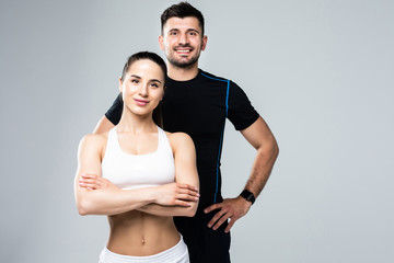 Team of fitness coaches man and woman isolated on white background