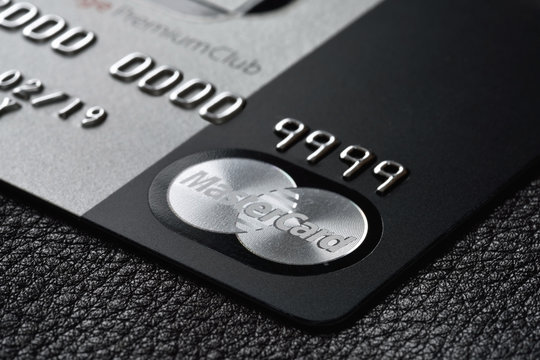 RUSSIA, MOSCOW - FEB 22, 2015: Premium credit card MasterCard Black Edition on the black leather background. Small depth of field