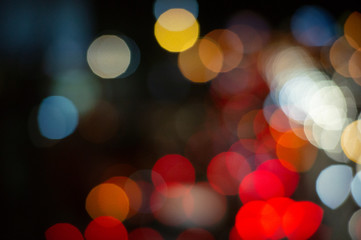 Fototapeta premium Bokeh night light on the avenue Light night at city blue bokeh sky festival abstract background blur lens flare reflection beautiful circle street with dark
