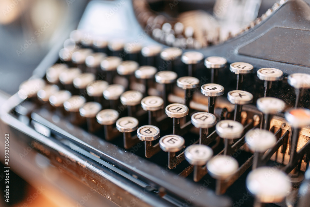 Fototapete rare printing device in macro. an old typewriter with buttons.