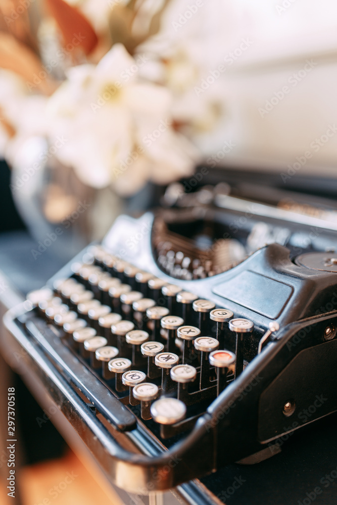 Fototapete rare printing device in macro. an old typewriter with buttons.