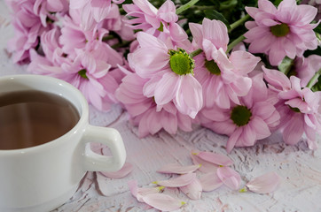 beautiful, purple flowers and a cup of tea.