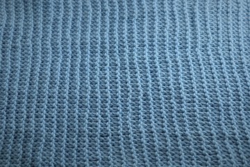 Fototapeta premium Large woolen knitting texture, blue color.