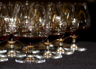 Glasses of cognac on a gray table