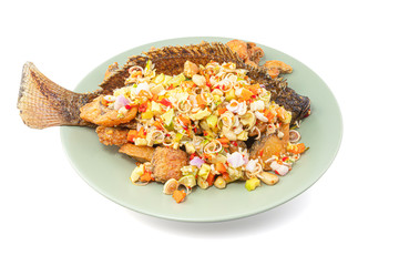Herb salad with deep fried fish and lemongrass isolated on the white background with clipping path, Thai food.