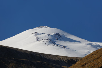 Cloudless sky over the snowy peak of Mount Elbrus, North Caucasus.