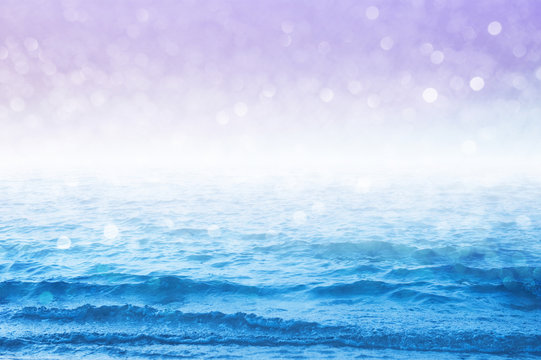 Pastel sea and sky images design with sparkling bokeh background