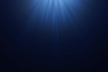 light rays through in deep blue water background