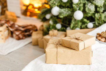 White decorative ball on the christmas tree on glitter bokeh background with blurred snow. Merry christmas card. Winter xmas theme. Happy New Year. Snowing.