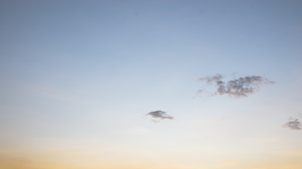 Beautiful view of sky and cloud at dusk,Sky Bright Blue Orange And Yellow Colors in twilight after sunset time.