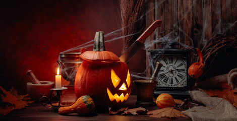 Halloween pumpkins on a old wooden background. Conceptual still life on the theme of Halloween.
