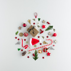 Christmas composition. Santa hat candy cane gift bauble set top view background with copy space for...