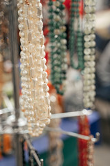 Many different jewelry and beads made of natural precious minerals. Jewelry is sold at the fair.