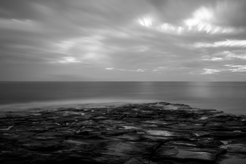 Fototapeta premium Black and White dramatic seascape of atlantic ocean coastline, long exposure.