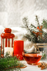 Cozy autumn  winter home, Christmas eve. Cup  tea, autumn garland on a wooden table near the bed with warm plaids. Autumn lifestyle lagom hygge.holiday and a weekend in the fall in winter on holidays.