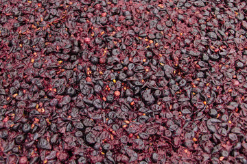 Red wine fermentation in process texture background