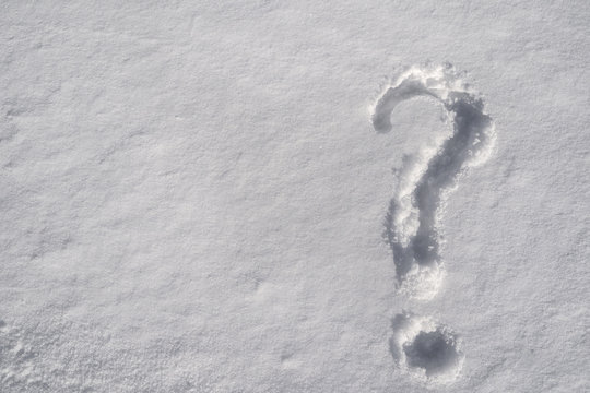 Question mark on white fresh snow