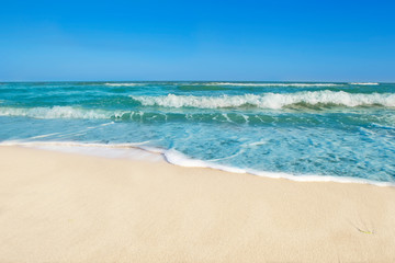Seascape. Ocean with waves and white sand