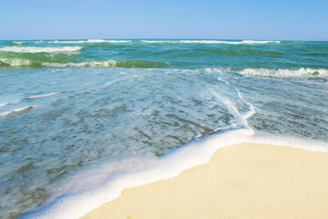 Seascape. Ocean with waves and white sand