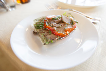 Jellied meat on a white plate