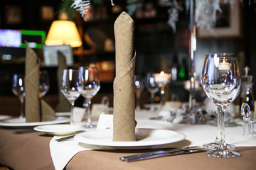 catering at a top event, glasses and flowers on the table, preparation for a significant event, beautiful dishes and glasses on the table, New Year's holiday table