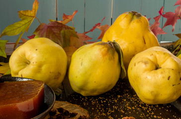 Homemade quince candy and raw fruits