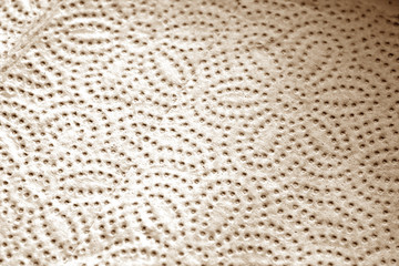 Paper towel tissue texture with blur effect in brown tone.