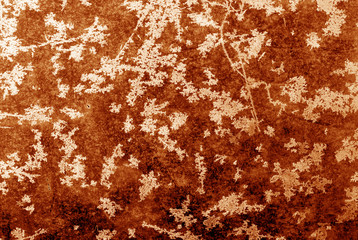 Abstract frost pattern on glass in orange tone.