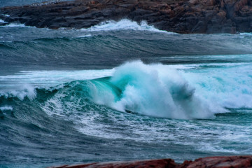 Fototapeta premium Stormy waves at Barents Sea, Arctic Ocean. Kola Peninsula, Murmansk region in Russia
