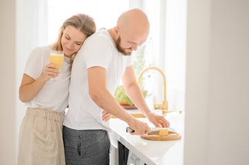 Fototapeta premium happy young couple prepare Breakfast and enjoy each other