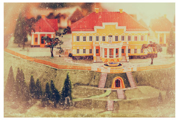 Retro postcard miniature old manor house and yard with trees.