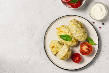 Healthy vegetable steamed rissoles with sour cream sauce.Top view, space for text.