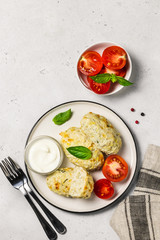 Healthy vegetable steamed rissoles with sour cream sauce.Top view, space for text.