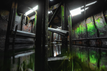 Inside of abandoned old ship at ships cemetery at low tide near Teriberka village in Murmansk Region. Kola peninsula, Northern Russia