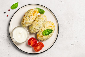 Healthy vegetable steamed rissoles with sour cream sauce.Top view, space for text.