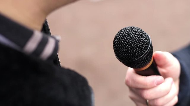 The man being interviewed on the street