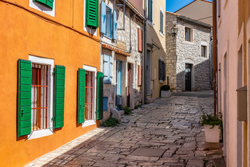 - Narrow stone street with colourful building facades in romantic Town of Rovinj, Istra, Croatia