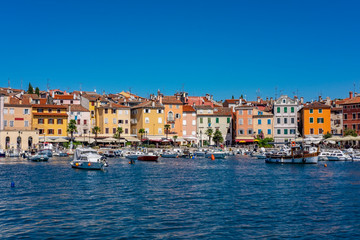 Fototapeta na wymiar Panoramic view of harbour and houses with colourful facades in Town of Rovinj on sunny summer day, Istra, Croatia 