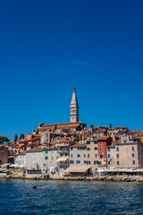 Fototapeta na wymiar Panoramic view of romantic and historic Town of Rovinj on sunny summer day, Istra, Croatia 