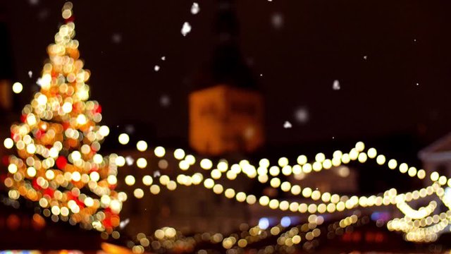 holidays and celebration concept - evening christmas market at old town hall square in tallinn