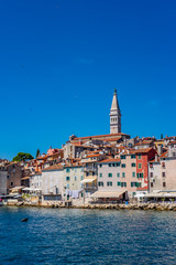 Fototapeta na wymiar Panoramic view of romantic and historic Town of Rovinj on sunny summer day, Istra, Croatia