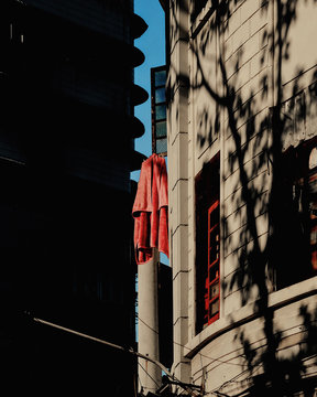 Low angle view of laundry hanging out of window