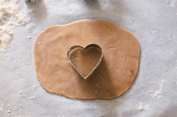 Dough of gingerbread cookie with heart shape